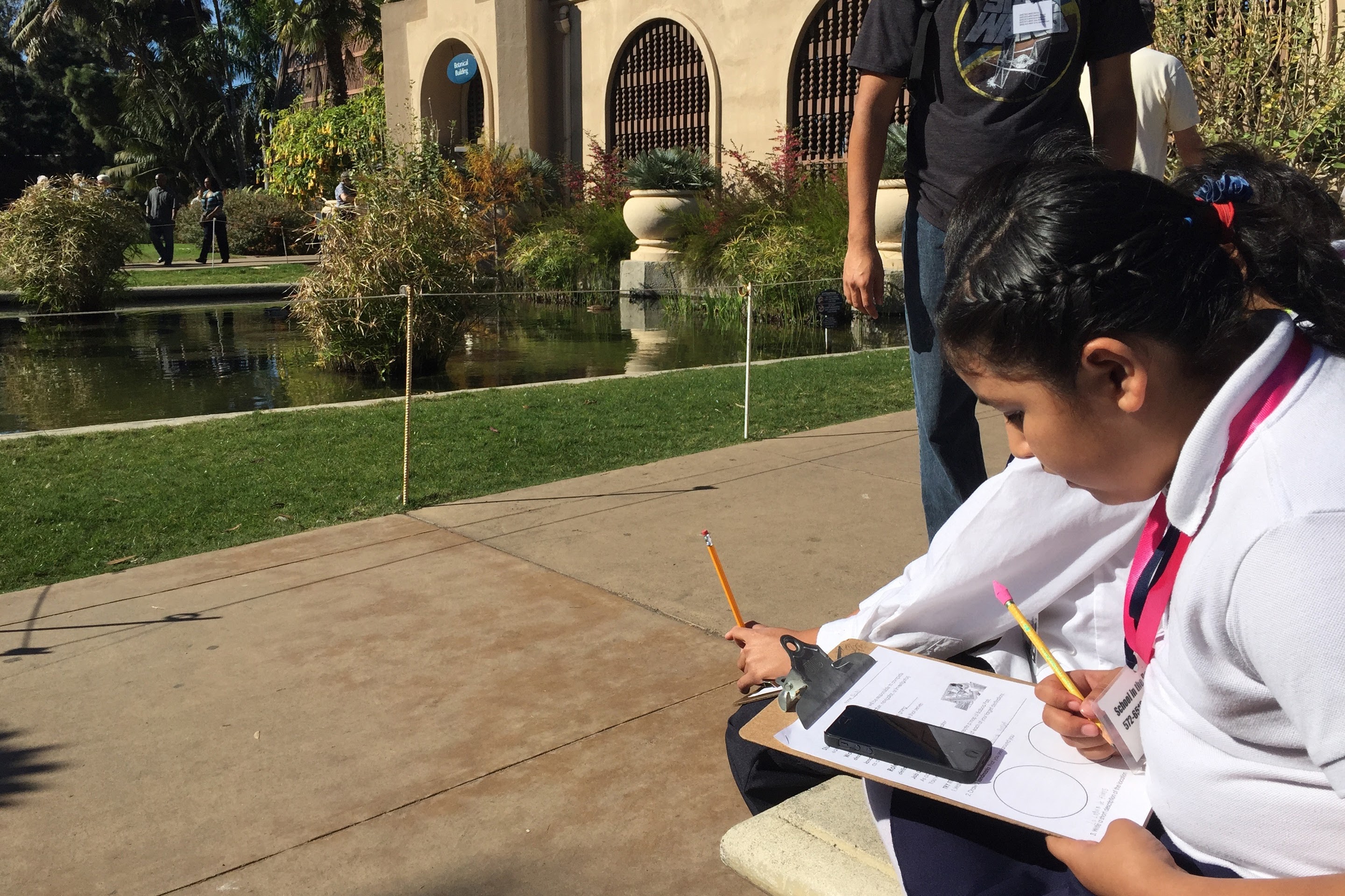 History center Students exploring with maps.